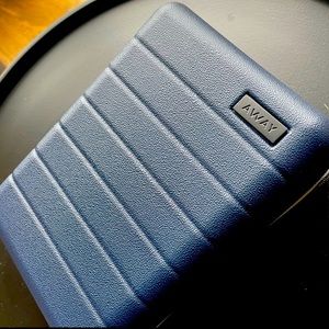 Mini Away cosmetics case with mini Sunday Riley products.